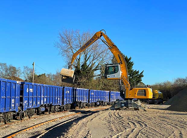 Material handler unloading type 1 train to remove cargo