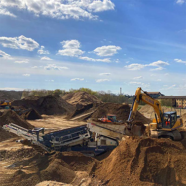 Waste material being recycled into usable aggregates
